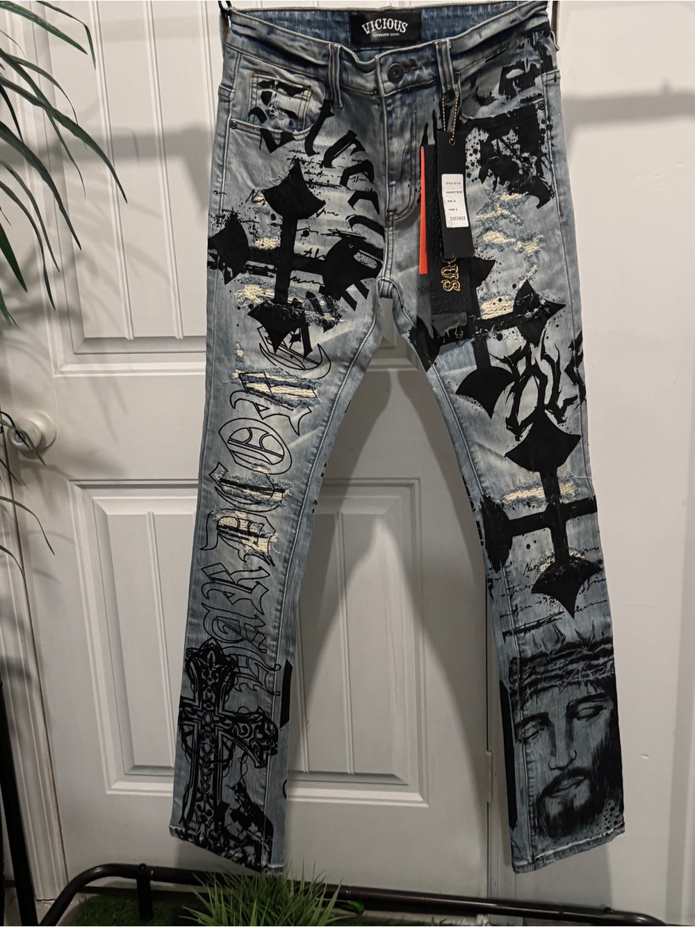 Light Blue Skinny Jeans with Black Graphic Print